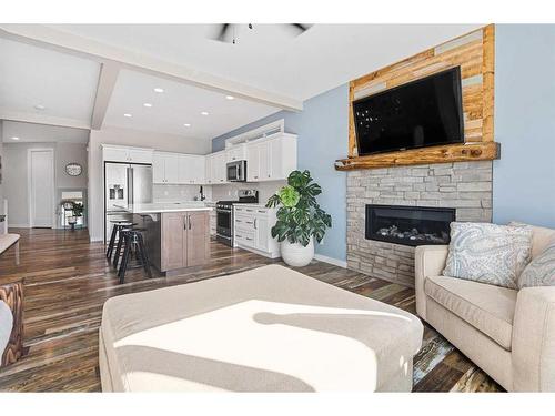 227 Reunion Green Nw, Airdrie, AB - Indoor Photo Showing Living Room With Fireplace