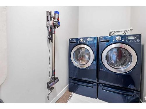 227 Reunion Green Nw, Airdrie, AB - Indoor Photo Showing Laundry Room