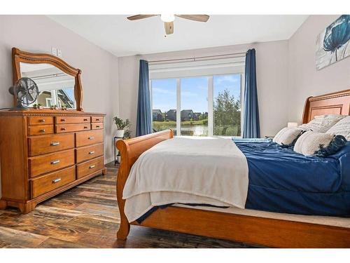 227 Reunion Green Nw, Airdrie, AB - Indoor Photo Showing Bedroom