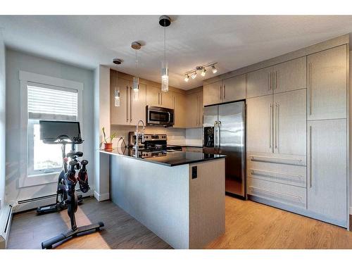 2302-11 Mahogany Row Se, Calgary, AB - Indoor Photo Showing Kitchen With Stainless Steel Kitchen