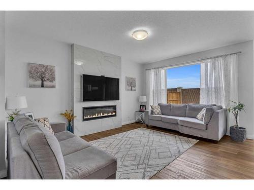 83 Red Sky Crescent, Calgary, AB - Indoor Photo Showing Living Room With Fireplace