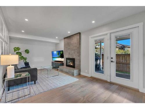 2203 Paliswood Bay Sw, Calgary, AB - Indoor Photo Showing Living Room With Fireplace