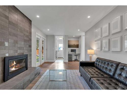 2203 Paliswood Bay Sw, Calgary, AB - Indoor Photo Showing Living Room With Fireplace