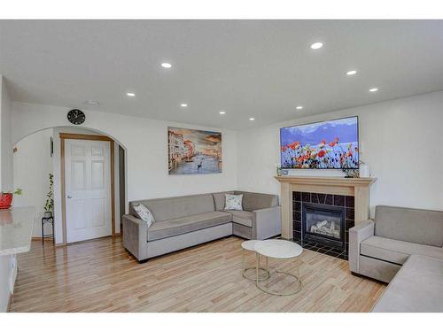 28 Tarawood Grove Ne, Calgary, AB - Indoor Photo Showing Living Room With Fireplace