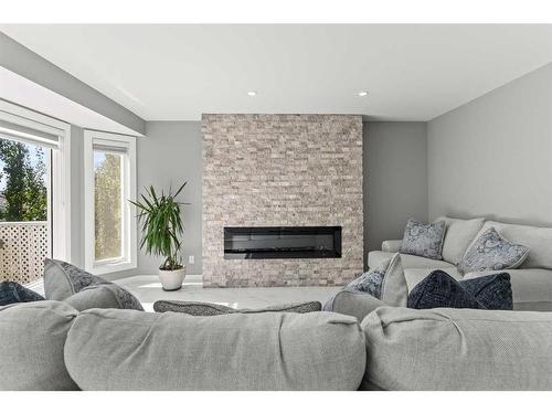 519 Sierra Morena Court Sw, Calgary, AB - Indoor Photo Showing Living Room With Fireplace