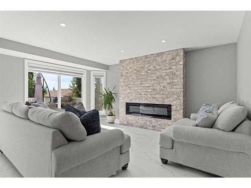 519 Sierra Morena Court Sw, Calgary, AB - Indoor Photo Showing Living Room With Fireplace