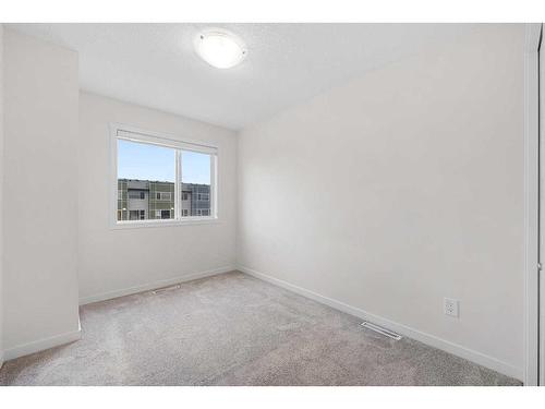 506-70 Saddlestone Drive Ne, Calgary, AB - Indoor Photo Showing Other Room