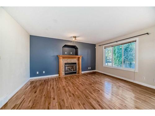 96 Weston Manor Sw, Calgary, AB - Indoor Photo Showing Living Room With Fireplace