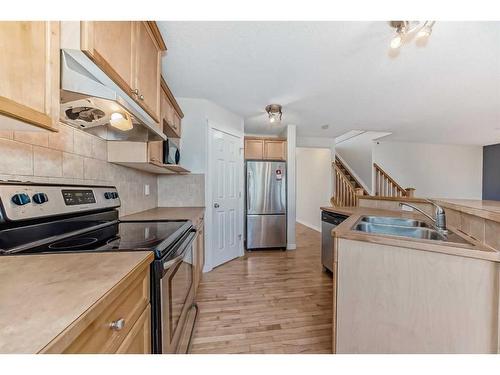 96 Weston Manor Sw, Calgary, AB - Indoor Photo Showing Kitchen With Double Sink