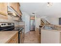 96 Weston Manor Sw, Calgary, AB  - Indoor Photo Showing Kitchen With Double Sink 