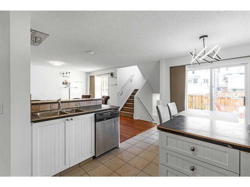 9416 Hidden Valley Drive Nw, Calgary, AB - Indoor Photo Showing Kitchen With Double Sink