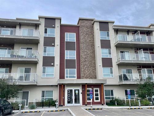 206-300 Harvest Hills Place Ne, Calgary, AB - Outdoor With Balcony With Facade