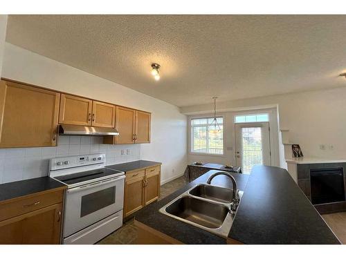 60 Rockyspring Grove Nw, Calgary, AB - Indoor Photo Showing Kitchen With Double Sink