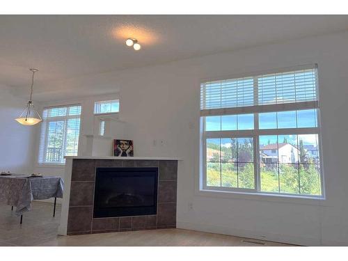 60 Rockyspring Grove Nw, Calgary, AB - Indoor Photo Showing Living Room With Fireplace