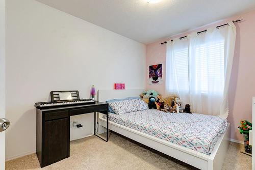 180 Silverado Way Sw, Calgary, AB - Indoor Photo Showing Bedroom