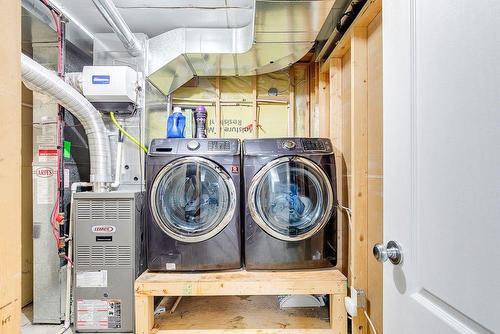 180 Silverado Way Sw, Calgary, AB - Indoor Photo Showing Laundry Room