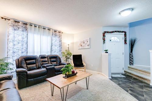 180 Silverado Way Sw, Calgary, AB - Indoor Photo Showing Living Room