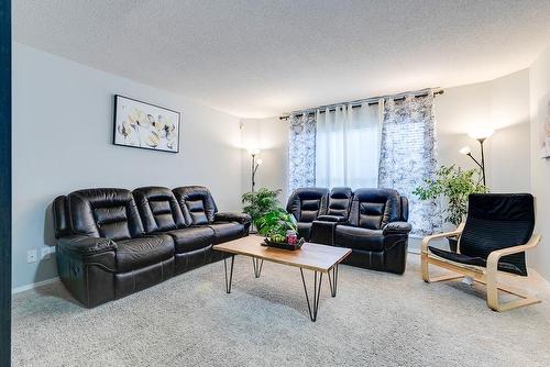 180 Silverado Way Sw, Calgary, AB - Indoor Photo Showing Living Room