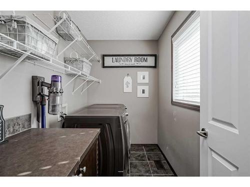 18 Chaparral Valley Place Se, Calgary, AB - Indoor Photo Showing Laundry Room