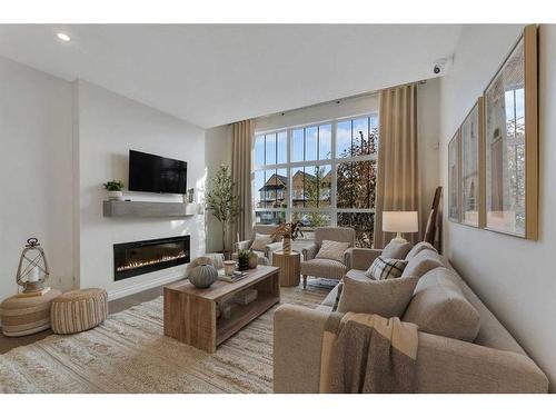 1015 Bayview Crescent Sw, Airdrie, AB - Indoor Photo Showing Living Room With Fireplace