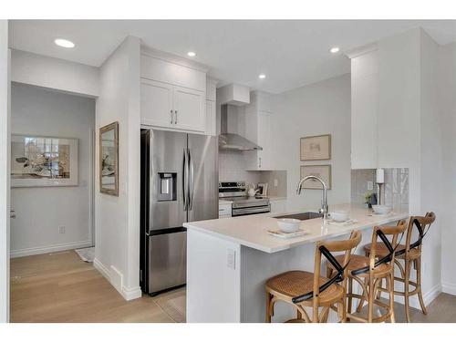 1015 Bayview Crescent Sw, Airdrie, AB - Indoor Photo Showing Kitchen With Stainless Steel Kitchen