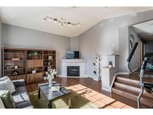 230 Arbour Ridge Park Nw, Calgary, AB - Indoor Photo Showing Living Room With Fireplace