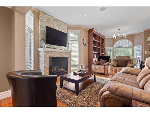 301 Lakeside Greens Crescent, Chestermere, AB - Indoor Photo Showing Living Room With Fireplace