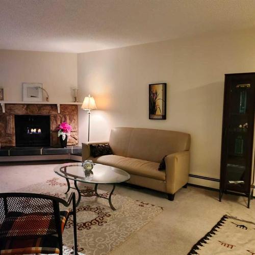 3109-4001C 49 Street Nw, Calgary, AB - Indoor Photo Showing Living Room With Fireplace