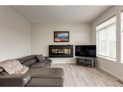 33 Sage Bluff Close Nw, Calgary, AB - Indoor Photo Showing Living Room With Fireplace