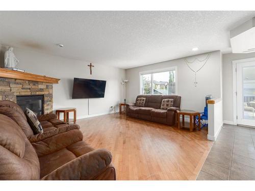 133 Brightonestone Garden Se, Calgary, AB - Indoor Photo Showing Living Room With Fireplace