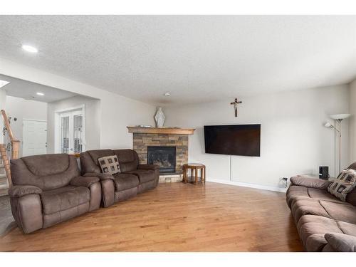 133 Brightonestone Garden Se, Calgary, AB - Indoor Photo Showing Living Room With Fireplace