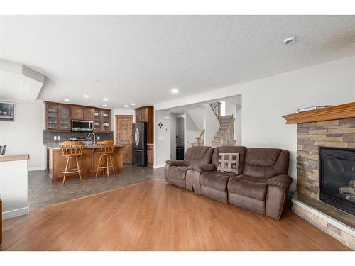 133 Brightonestone Garden Se, Calgary, AB - Indoor Photo Showing Living Room With Fireplace