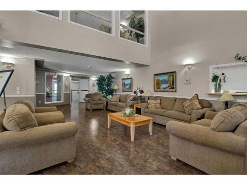 3323-3000 Millrise Point Sw, Calgary, AB - Indoor Photo Showing Living Room