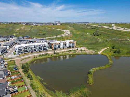 2409-42 Cranbrook Gardens Se, Calgary, AB - Outdoor With Body Of Water With View