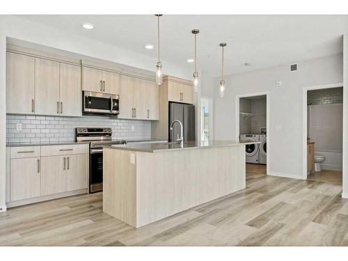 2409-42 Cranbrook Gardens Se, Calgary, AB - Indoor Photo Showing Kitchen With Upgraded Kitchen