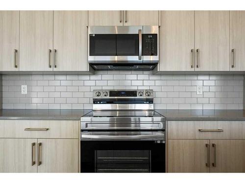 2409-42 Cranbrook Gardens Se, Calgary, AB - Indoor Photo Showing Kitchen With Upgraded Kitchen