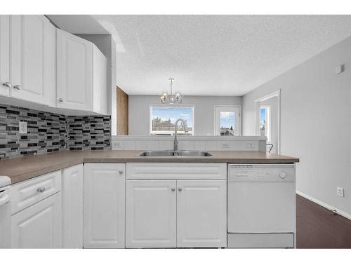 14 Taravista Gardens Ne, Calgary, AB - Indoor Photo Showing Kitchen With Double Sink