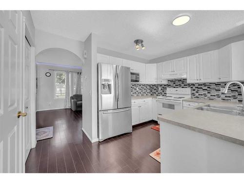 14 Taravista Gardens Ne, Calgary, AB - Indoor Photo Showing Kitchen With Double Sink With Upgraded Kitchen