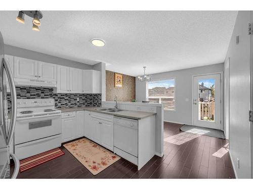 14 Taravista Gardens Ne, Calgary, AB - Indoor Photo Showing Kitchen With Double Sink