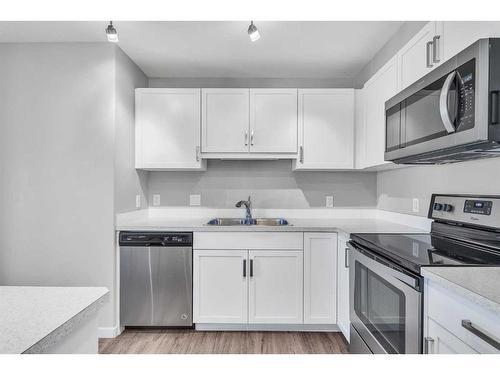 2306-450 Kincora Glen Road Nw, Calgary, AB - Indoor Photo Showing Kitchen With Double Sink