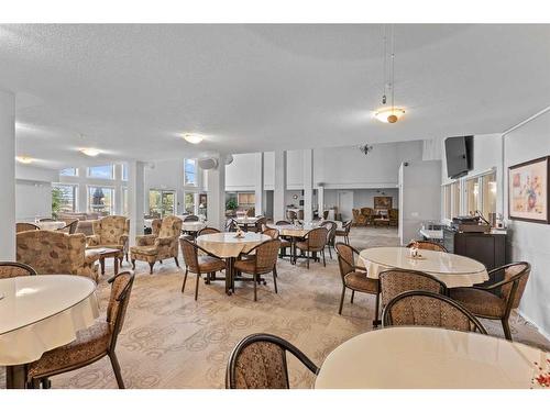 113-5000 Somervale Court Sw, Calgary, AB - Indoor Photo Showing Dining Room