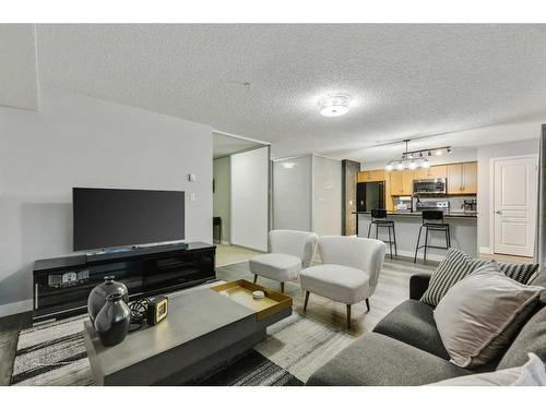 110-250 New Brighton Villas Se, Calgary, AB - Indoor Photo Showing Living Room