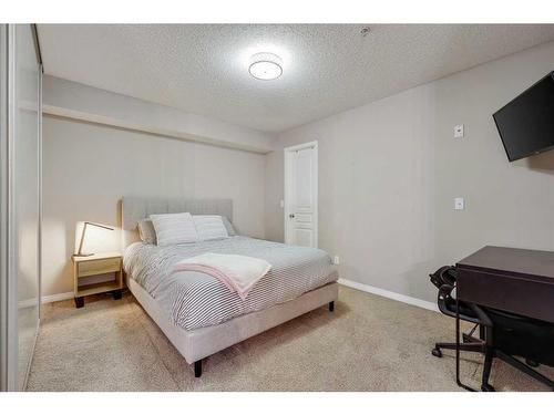 110-250 New Brighton Villas Se, Calgary, AB - Indoor Photo Showing Bedroom