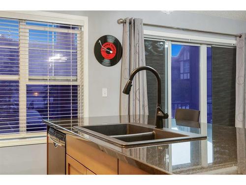 110-250 New Brighton Villas Se, Calgary, AB - Indoor Photo Showing Kitchen With Double Sink