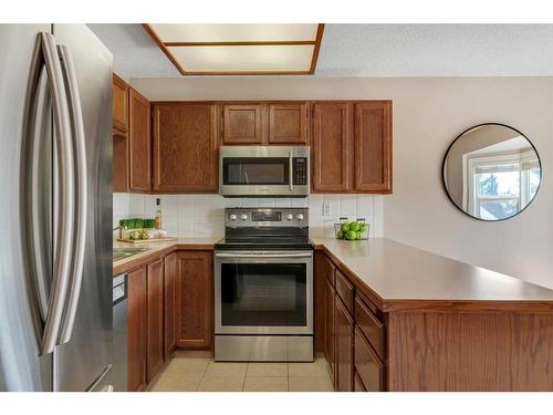 153 Woodglen Grove Sw, Calgary, AB - Indoor Photo Showing Kitchen With Stainless Steel Kitchen