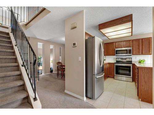 153 Woodglen Grove Sw, Calgary, AB - Indoor Photo Showing Kitchen With Stainless Steel Kitchen