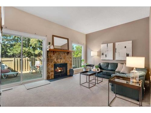 153 Woodglen Grove Sw, Calgary, AB - Indoor Photo Showing Living Room With Fireplace