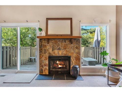 153 Woodglen Grove Sw, Calgary, AB - Indoor Photo Showing Other Room With Fireplace