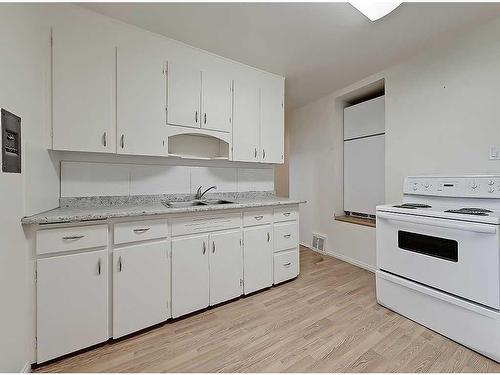 2610 15A Street Sw, Calgary, AB - Indoor Photo Showing Kitchen With Double Sink