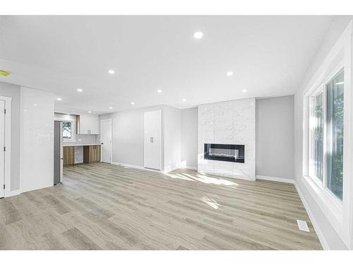 3239 Dovercliffe Road Se, Calgary, AB - Indoor Photo Showing Living Room With Fireplace